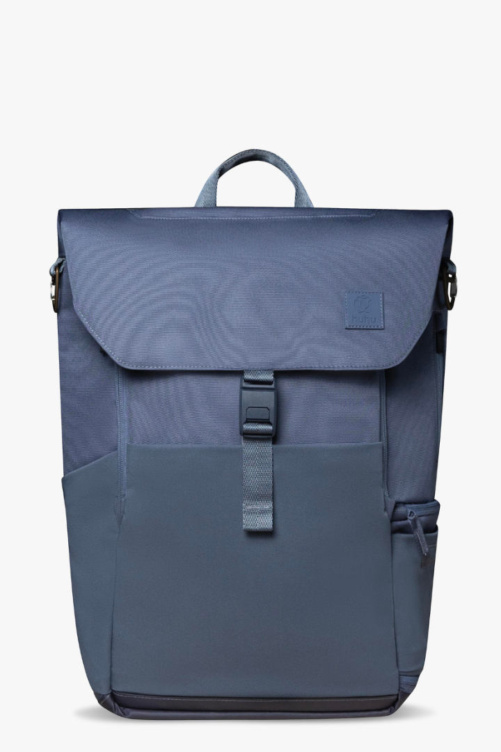 Front view of blue backpack showing front magnetic clasp and pockets.