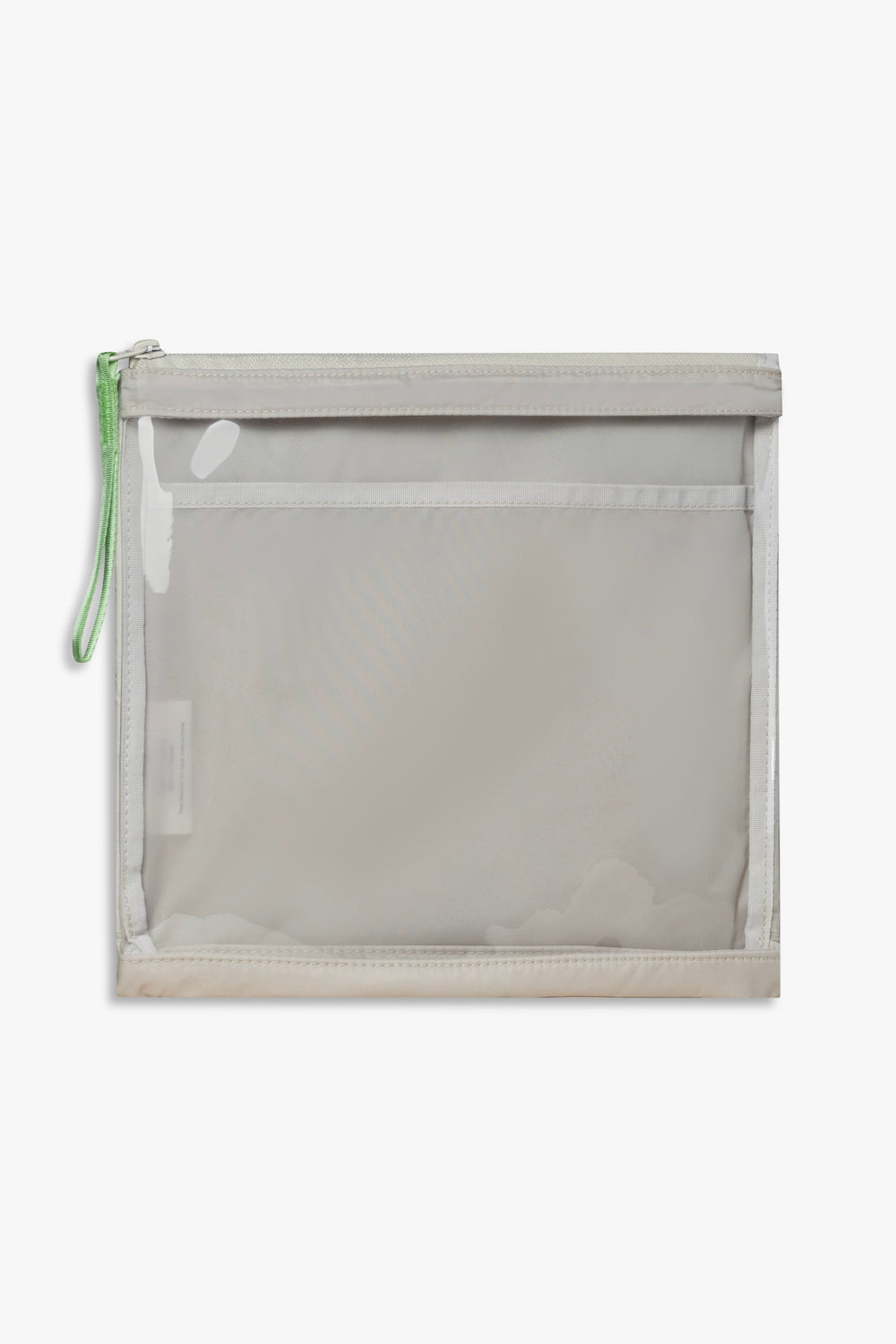Front view of beige changing wallet with clear front and green zipper pull.