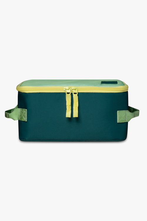 Front view of green insulated cooler bag with yellow zipper against a white background.