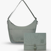 A sage green convertible shoulder bag shown with its matching flat pouch, set against a clean white background.