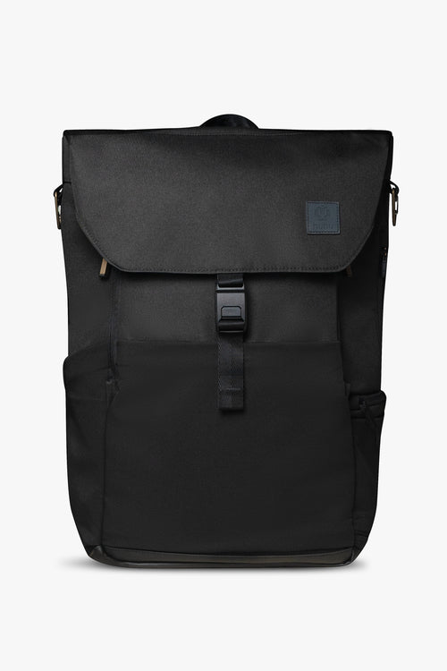 Front view of closed black backpack standing upright against a white background.