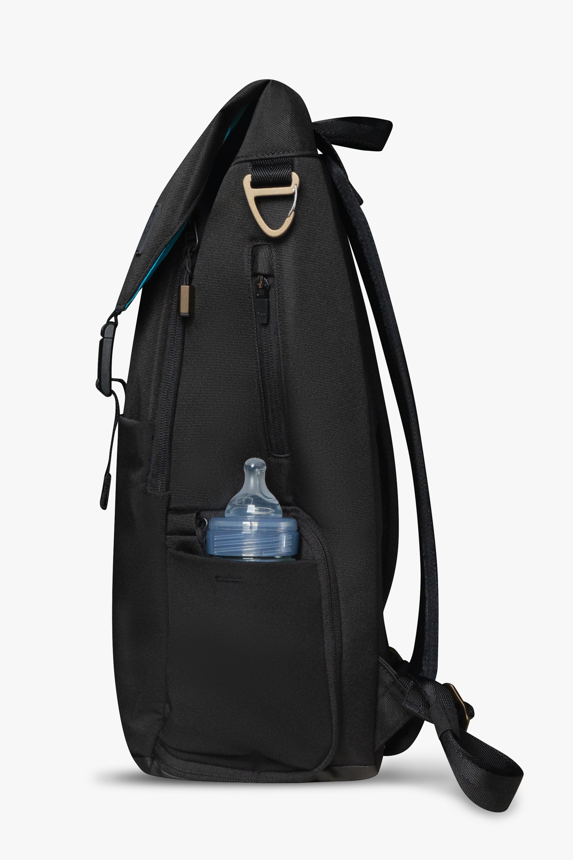 Side view of black backpack against a white background. Showing baby bottle in side stretchy bottle pocket. Bronze bag hardware and exterior zipper pocket are visible.