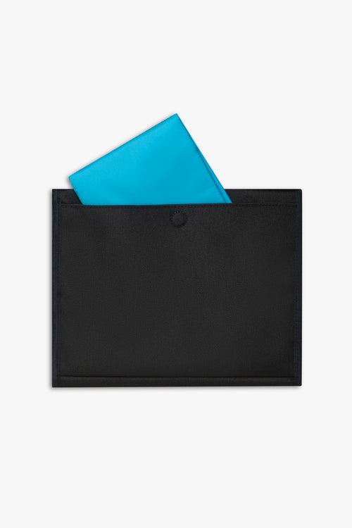 Back view of closed black changing wallet against a white background showing blue changing pad sitting halfway out of back pocket.