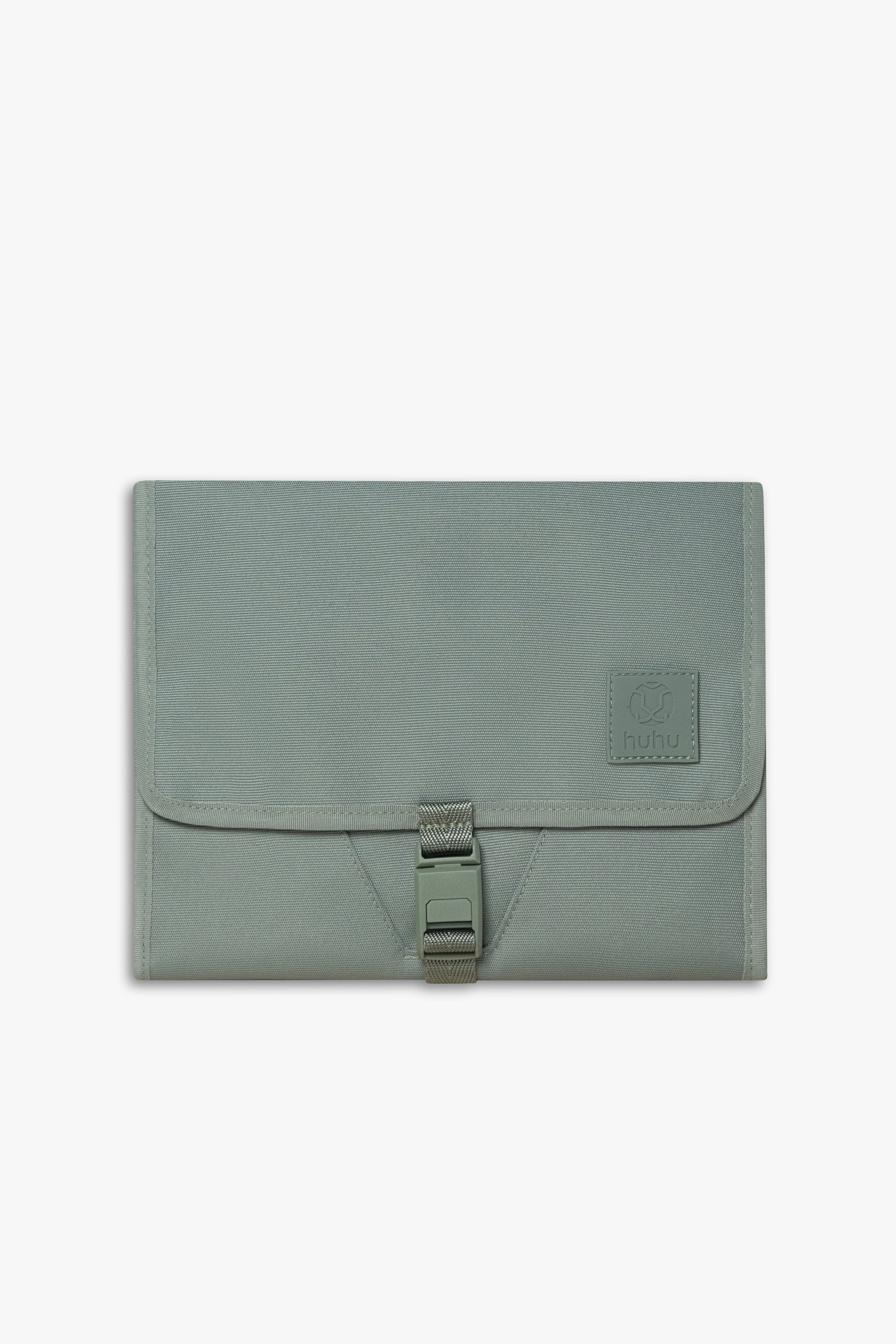 Front view of closed green changing wallet against a white background.