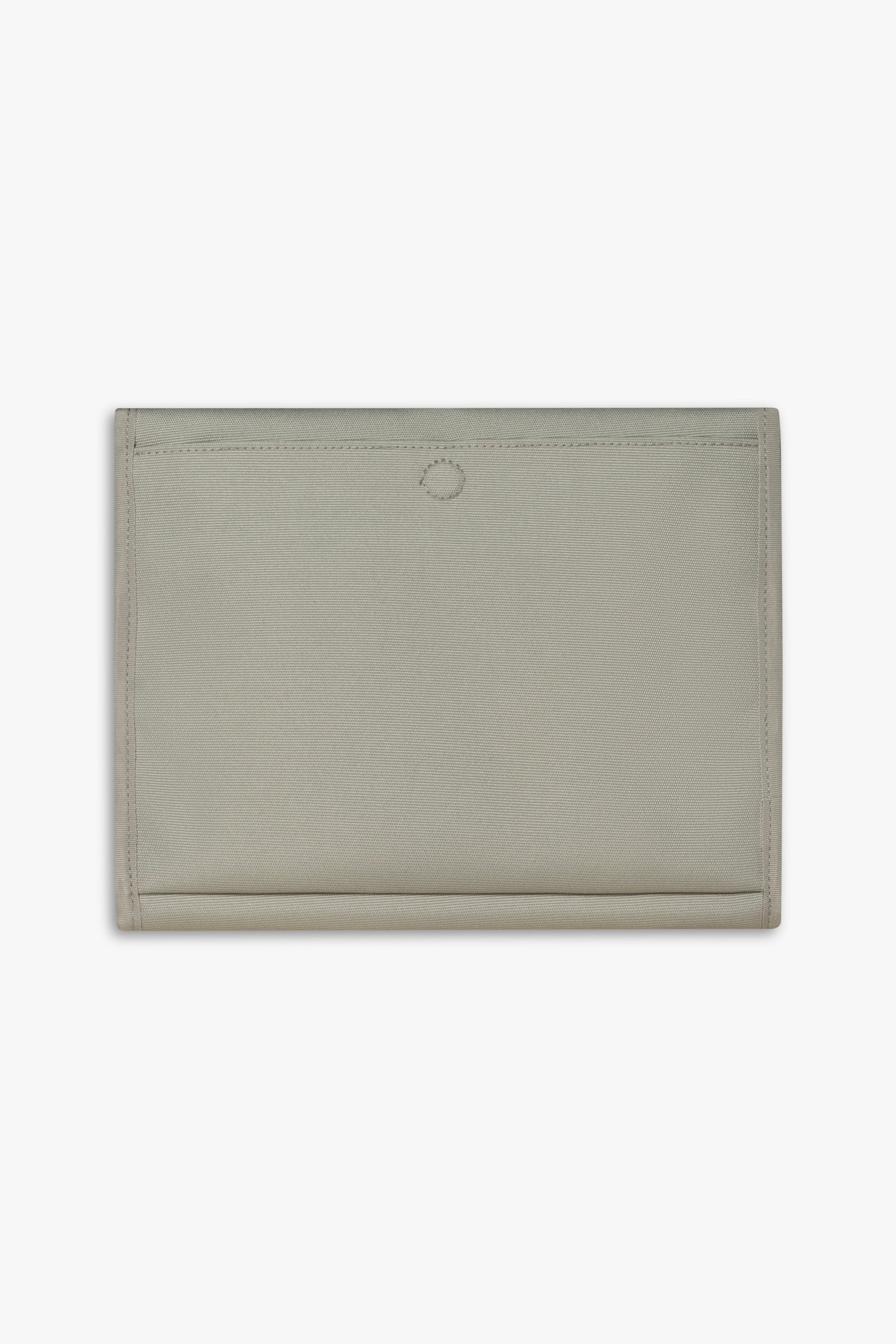 Back view of closed taupe changing wallet against a white background showing back, magnetic changing pad pocket.